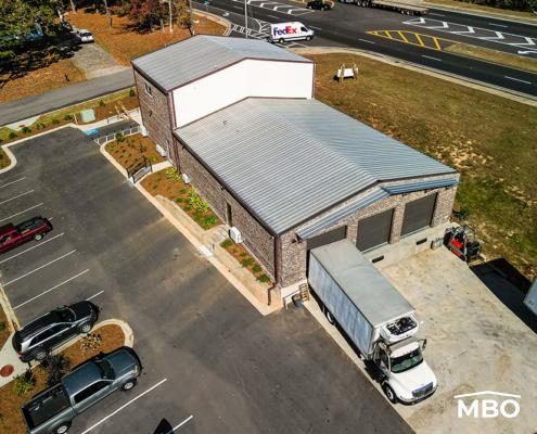 the food co-op in Georgia with brick exterior customizations added to the exterior metal panels