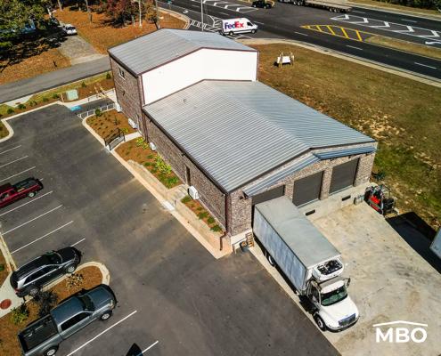the food co-op in Georgia with brick exterior customizations added to the exterior metal panels