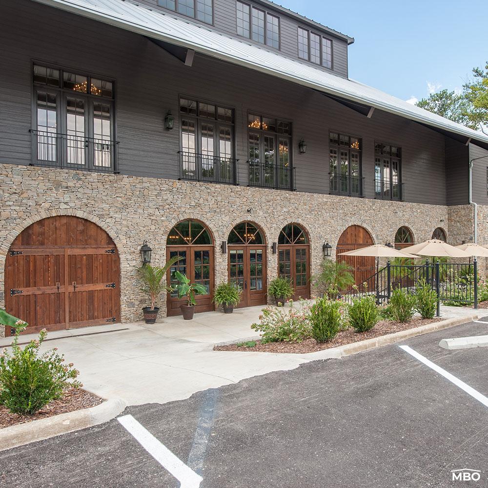 a wood and stone sided custom metal building