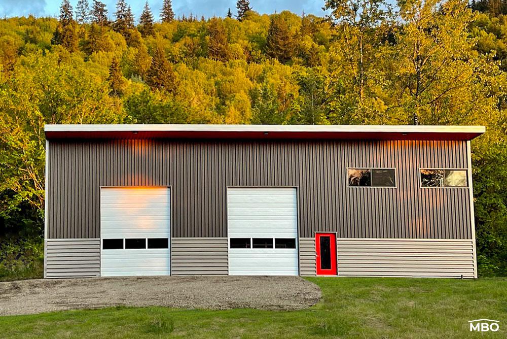 barndominium-cold-formed a unique cold formed metal building with two tone grey siding arranged in a pattern