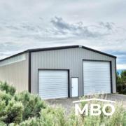 Grey Metal Garage Surrounded by Greenery