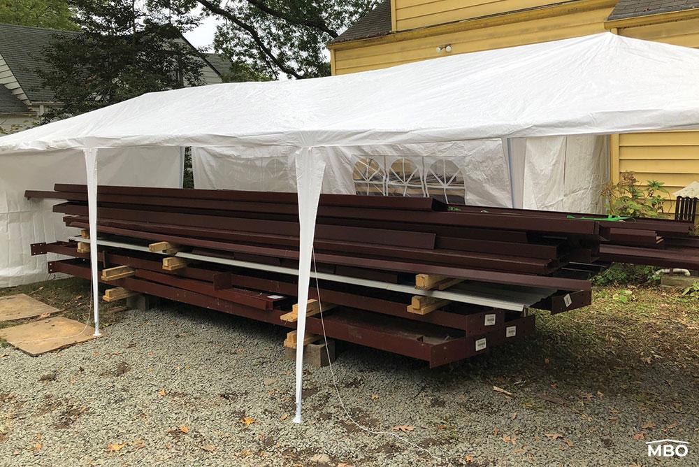 Red Iron Beams under a White Tent